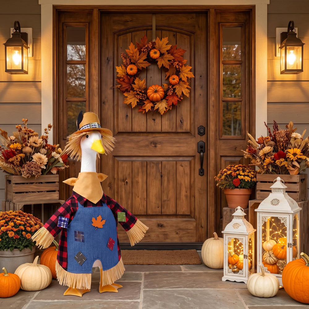 Close-up of Hodola scarecrow outfit showing yellow scarf and denim overalls