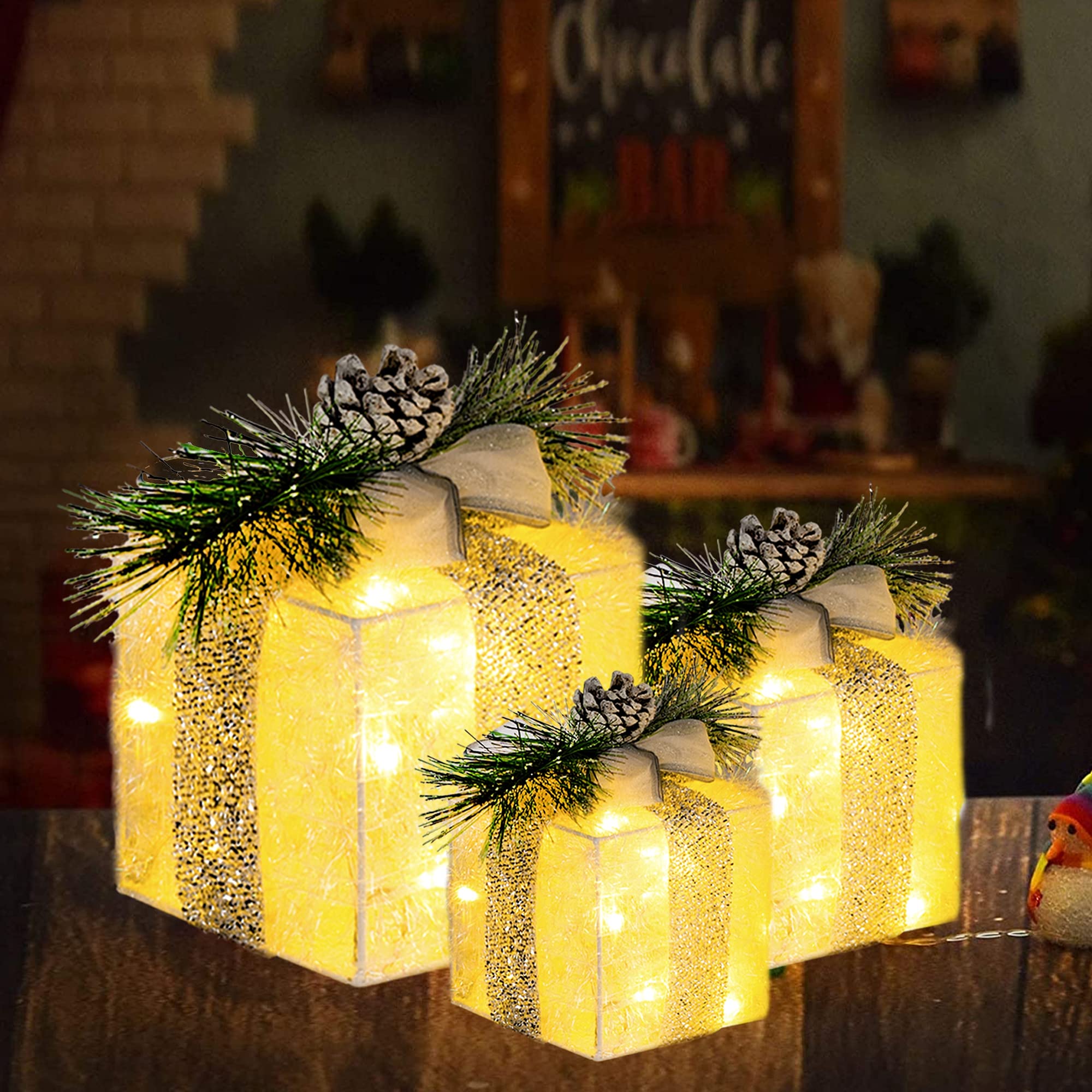 Close-up of Hourleey lighted gift box showing shiny tinsel