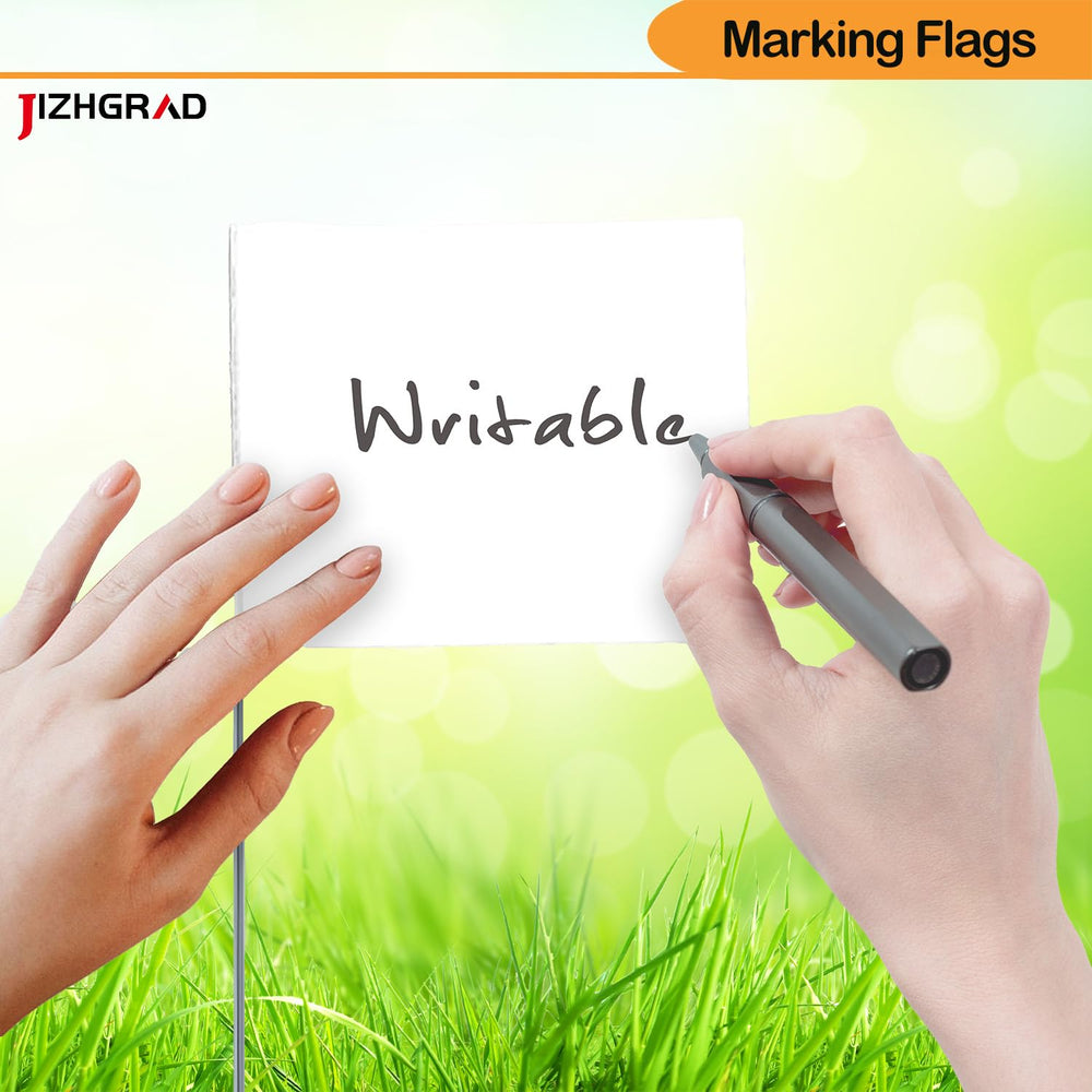 Close-up of JIZHGRAD marking flags in yard
