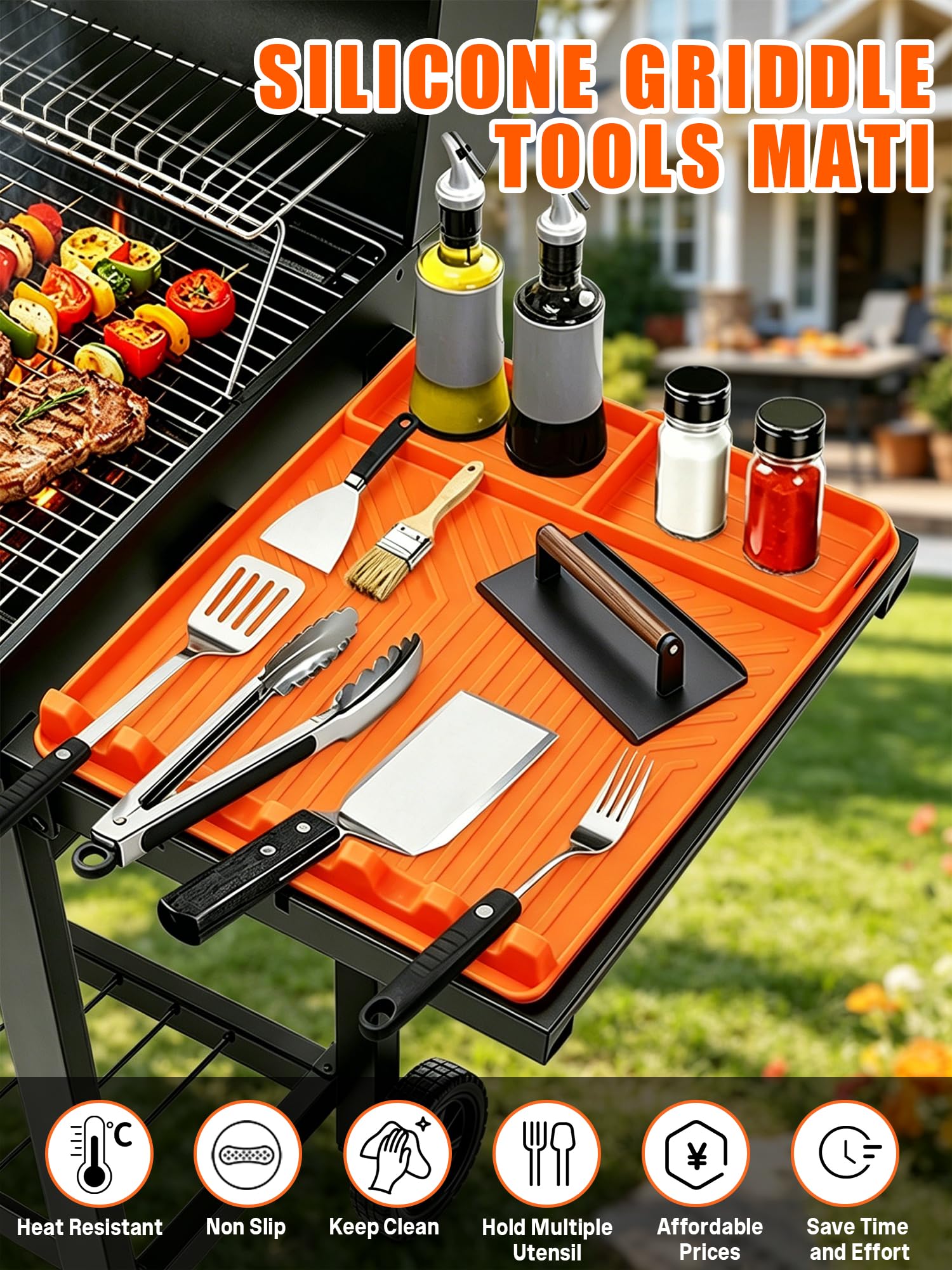 Close-up of JoySil silicone grill mat with spatulas and scrapers