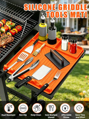 Close-up of JoySil silicone grill mat with spatulas and scrapers