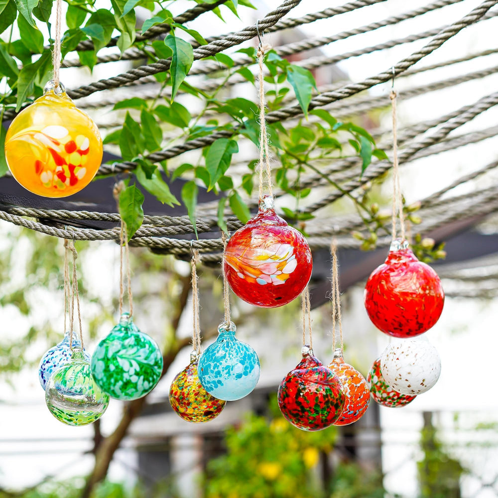 Close-up of KRISININE glass ball ornament with intricate details