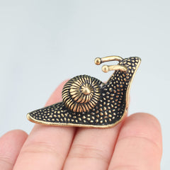 Close-up of LCCCK Brass Snail Figurine detailing