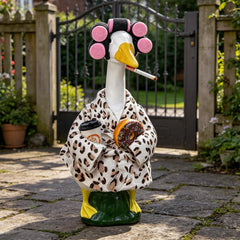 Close-up of leopard print goose outfit with coffee cup and donuts