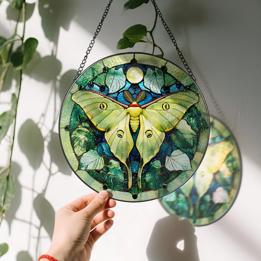 Close-up of Luna Moth design on stained glass suncatcher