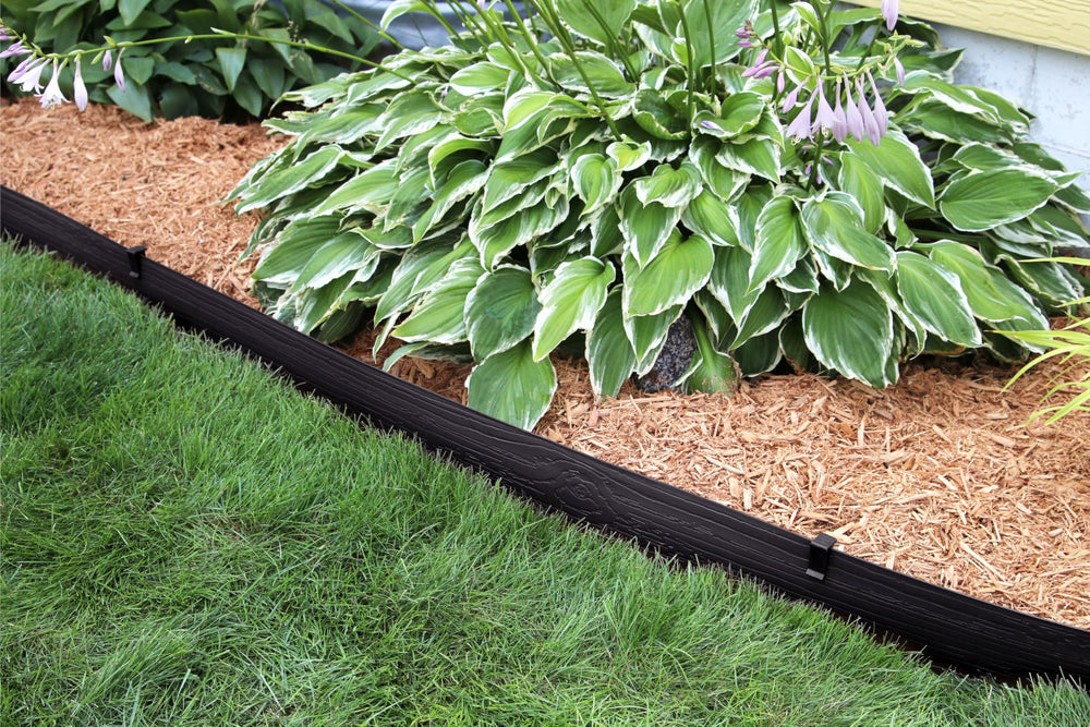 Close-up of Master Mark Landscape Edging Coil showing flexibility