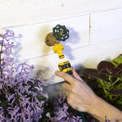 Close-up of Melnor faucet adapter in yellow and black