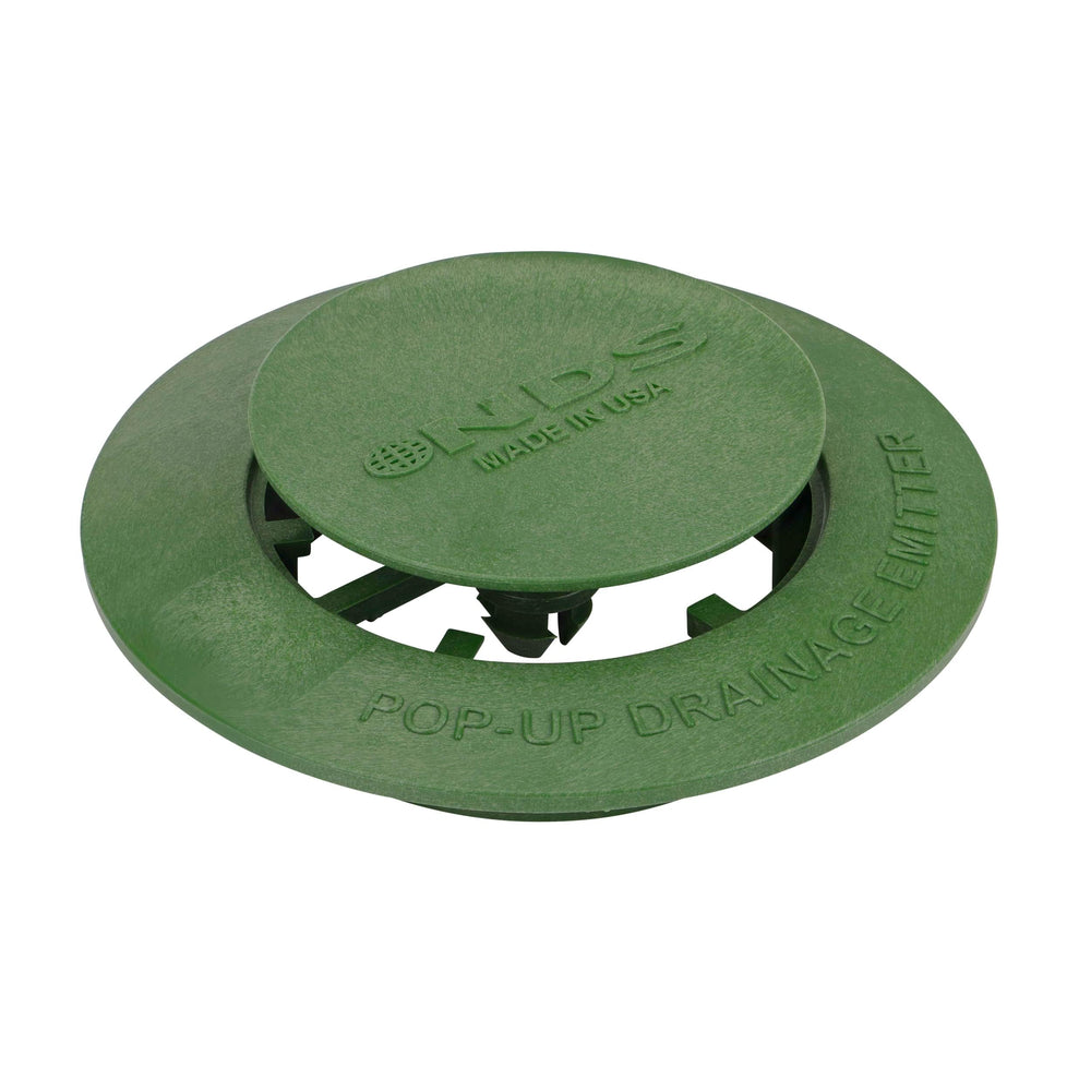 Close-up of NDS Pop-Up Drainage Emitter cap in raised position