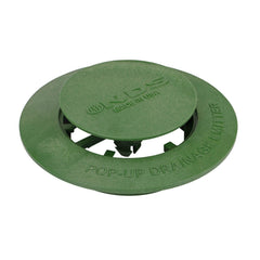 Close-up of NDS Pop-Up Drainage Emitter cap in raised position