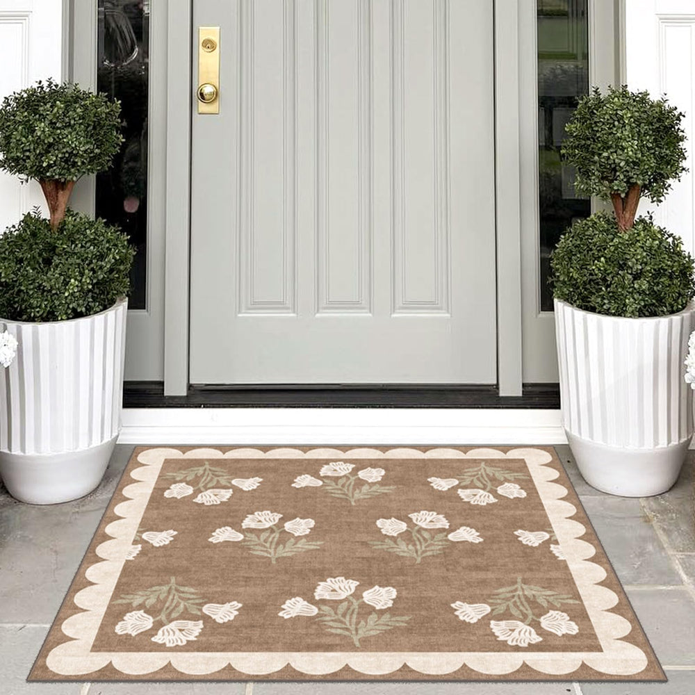 Close-up of Othilic rug scalloped edge and floral pattern