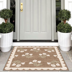 Close-up of Othilic rug scalloped edge and floral pattern