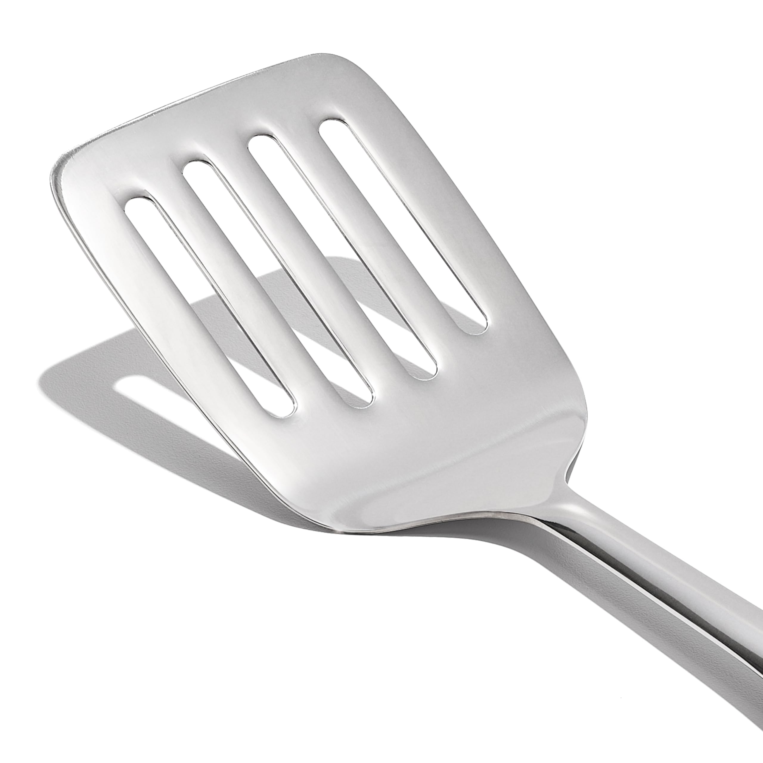 Close-up of OXO Steel Cooking Turner's flexible head