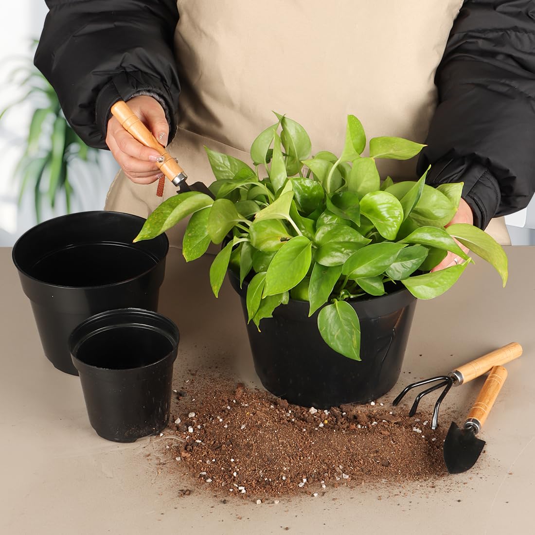 Close-up of RooTrimmer 4-inch black nursery pot with drainage holes