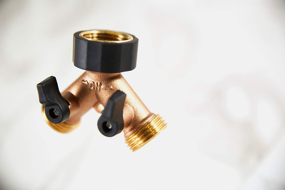 Close-up of the ball-valve levers on the Orbit Brass Dual-Outlet Faucet Adapter