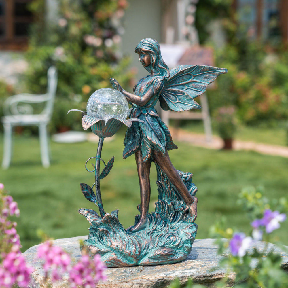 Close-up of the crackle glass globe on the fairy statue