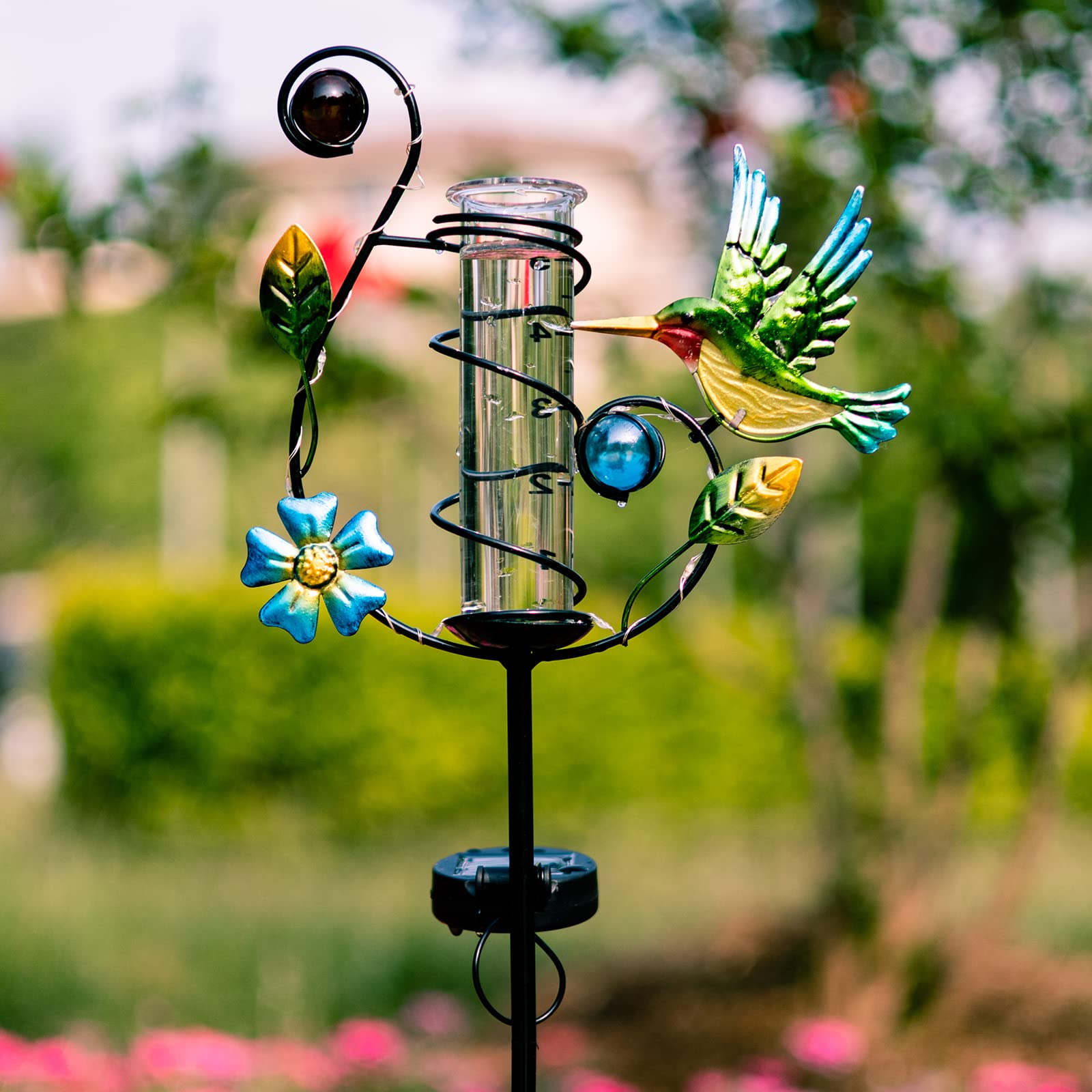 Close-up of the glass tube and measurement scale of Stargarden Rain Gauge