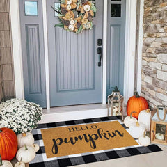 Close-up of the pumpkin welcome doormat in black and white