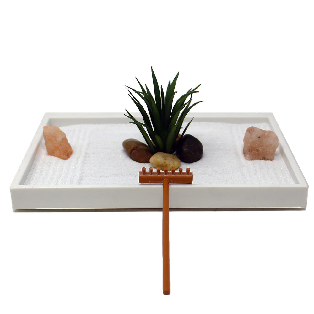 Close-up of the rake and river rocks in the Mini Zen Garden