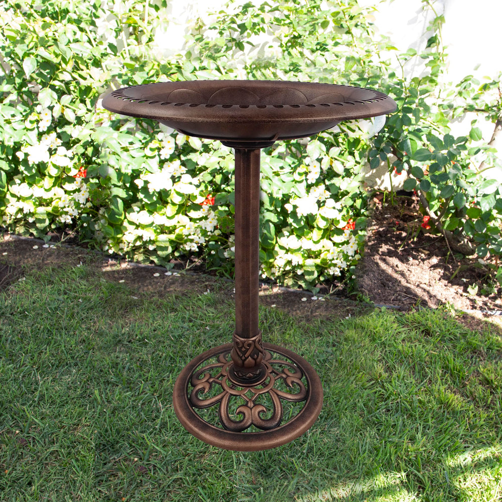 Close-up of the scrollwork detailing on the birdbath base