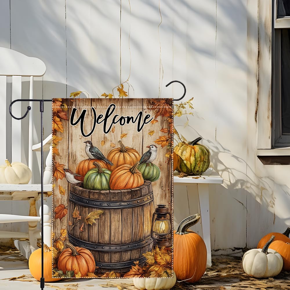 Close-up of the wooden barrel and pumpkins on the garden flag