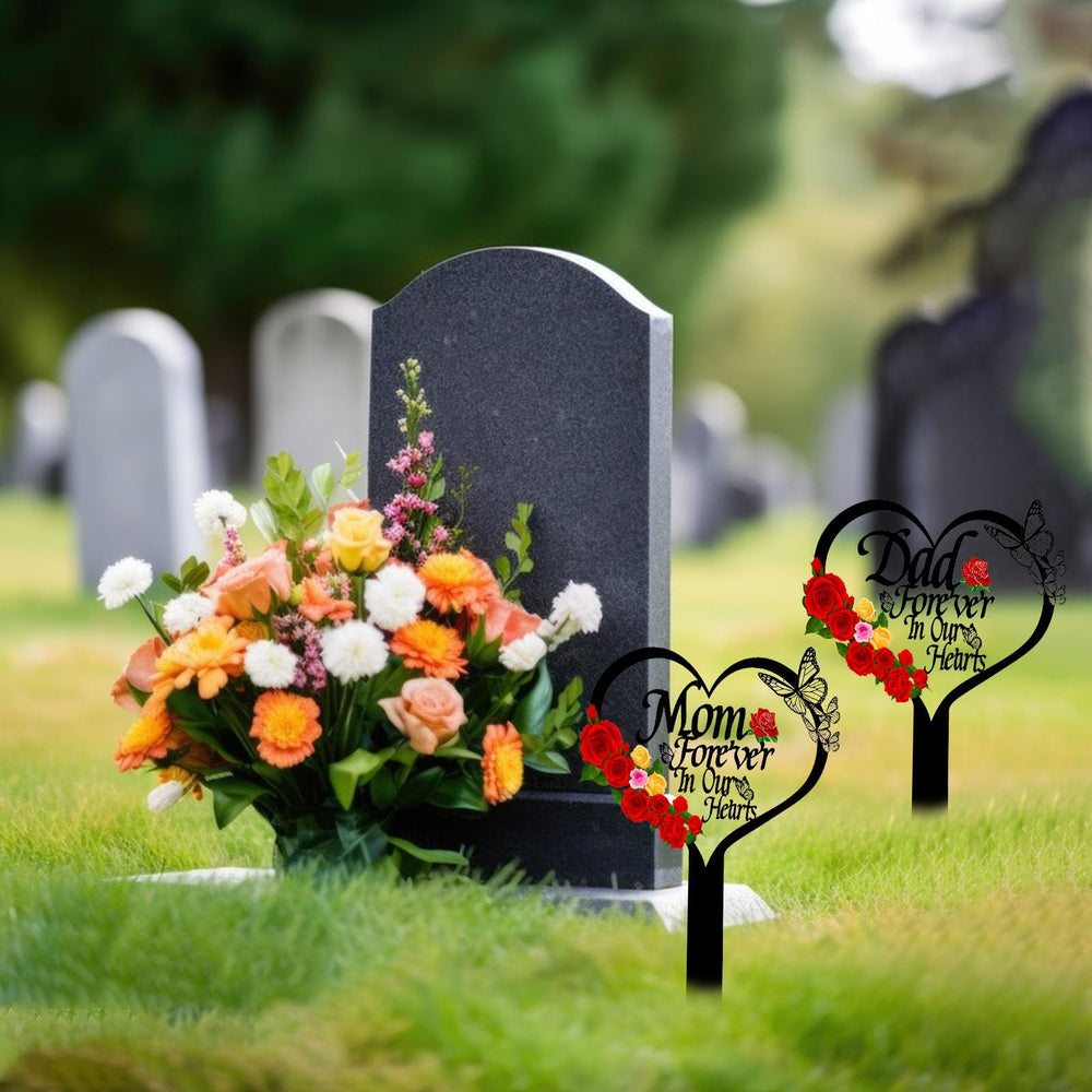 Close-up of the word 'Mom' on the heart-shaped memorial plaque