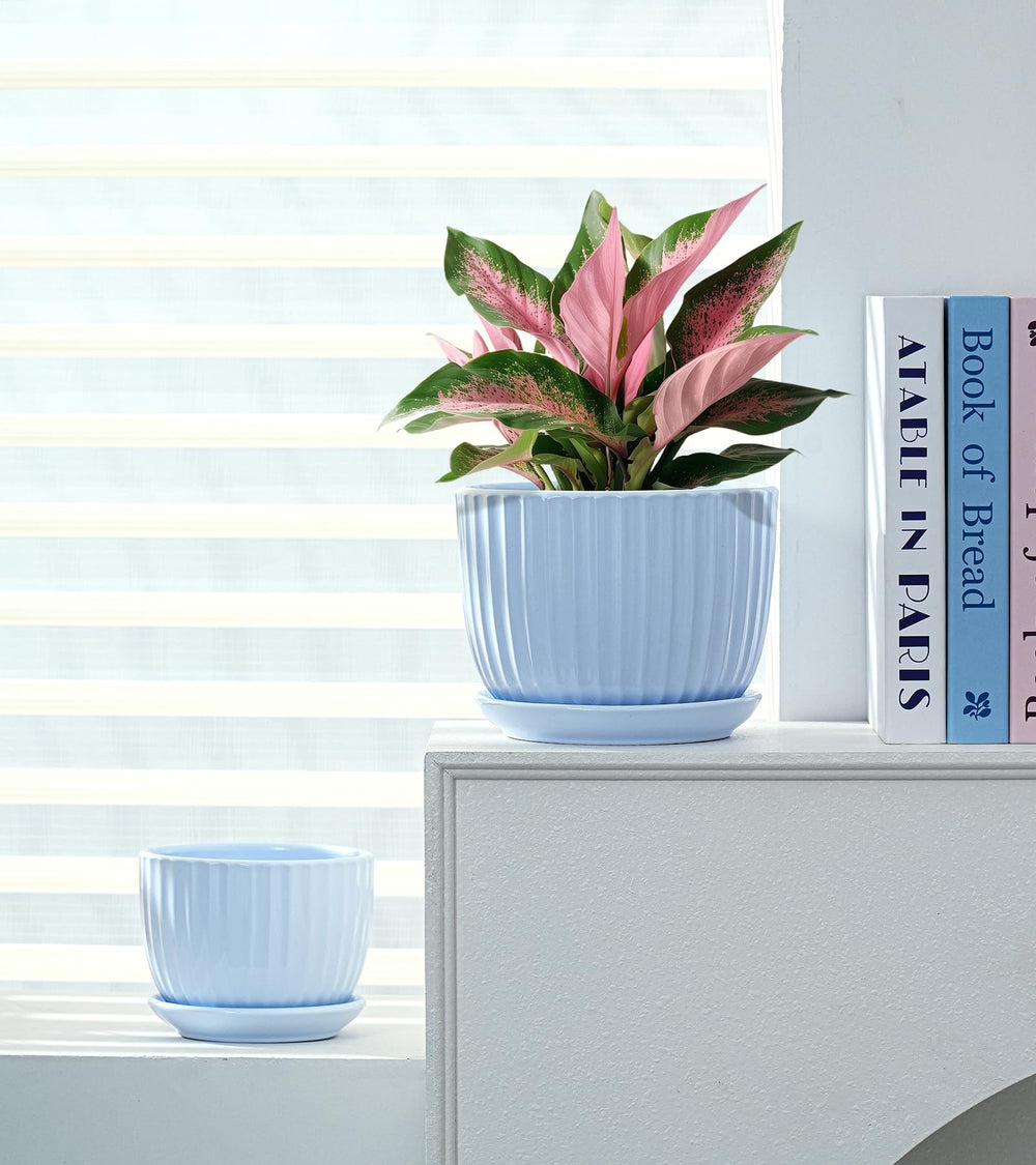 Close-up of Ton Sin Sky Blue Ceramic Flower Pot's drainage holes