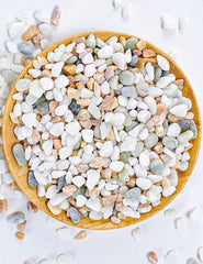 Close-up of TOYPOPOR decorative pebbles showing pastel colours