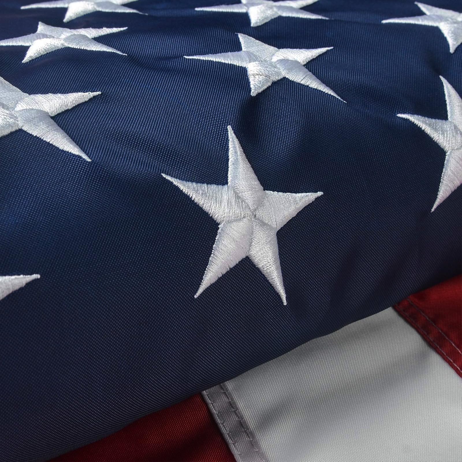 Close-up of VORENUS American Flag brass grommet