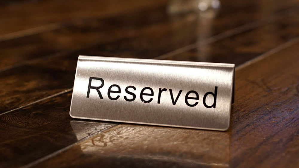 Close-up of Winco Reserved Table Sign showing clear text