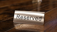 Close-up of Winco Reserved Table Sign showing clear text