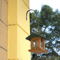 Close-up view of Mkono iron hook mounted on wood