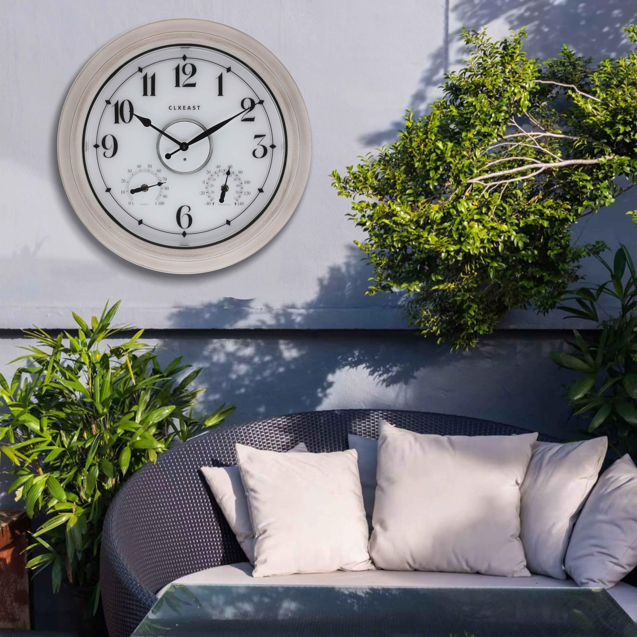 CLXEAST outdoor clock in garden setting during night