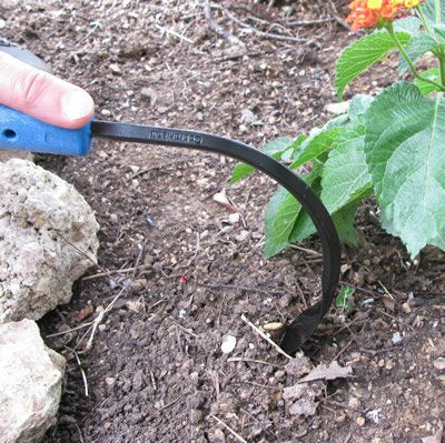 CobraHead Original Weeder with soil and weeds