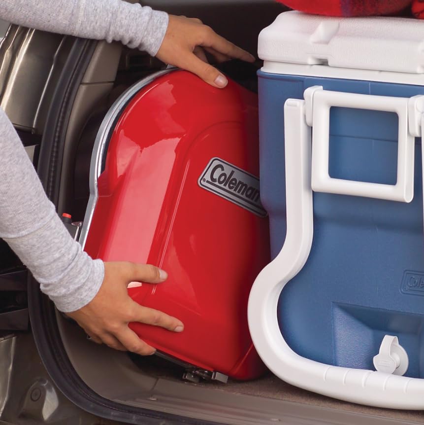 Coleman Fold 'N Go Portable Propane Grill in outdoor setting