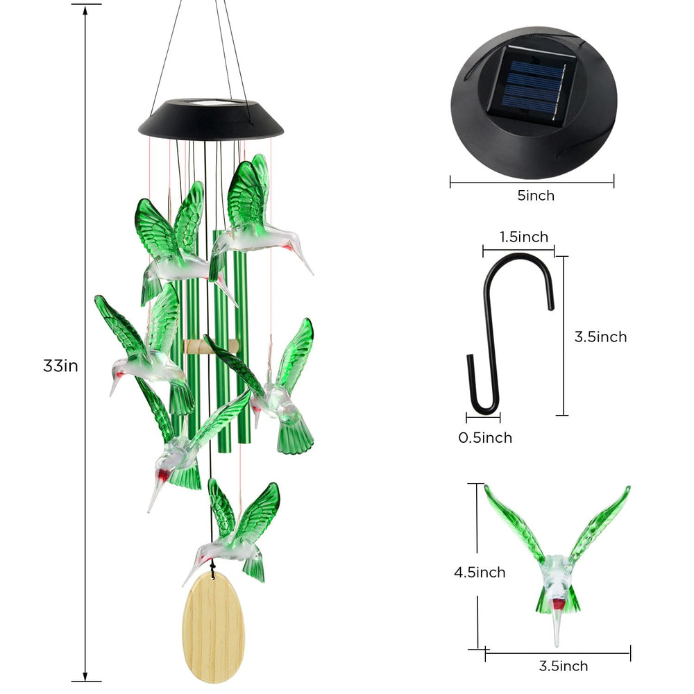 Colorful display of hummingbird wind chimes at night
