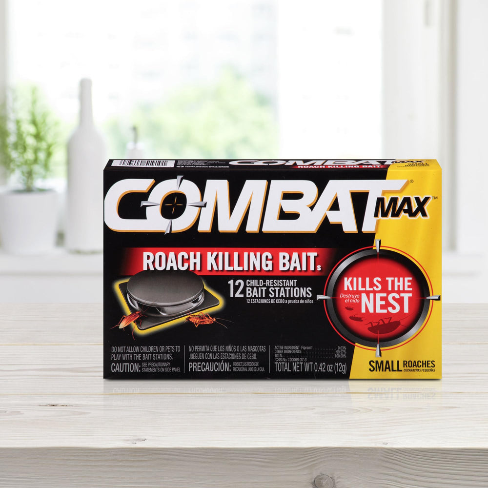 Combat Max gel syringe with bait stations on a countertop
