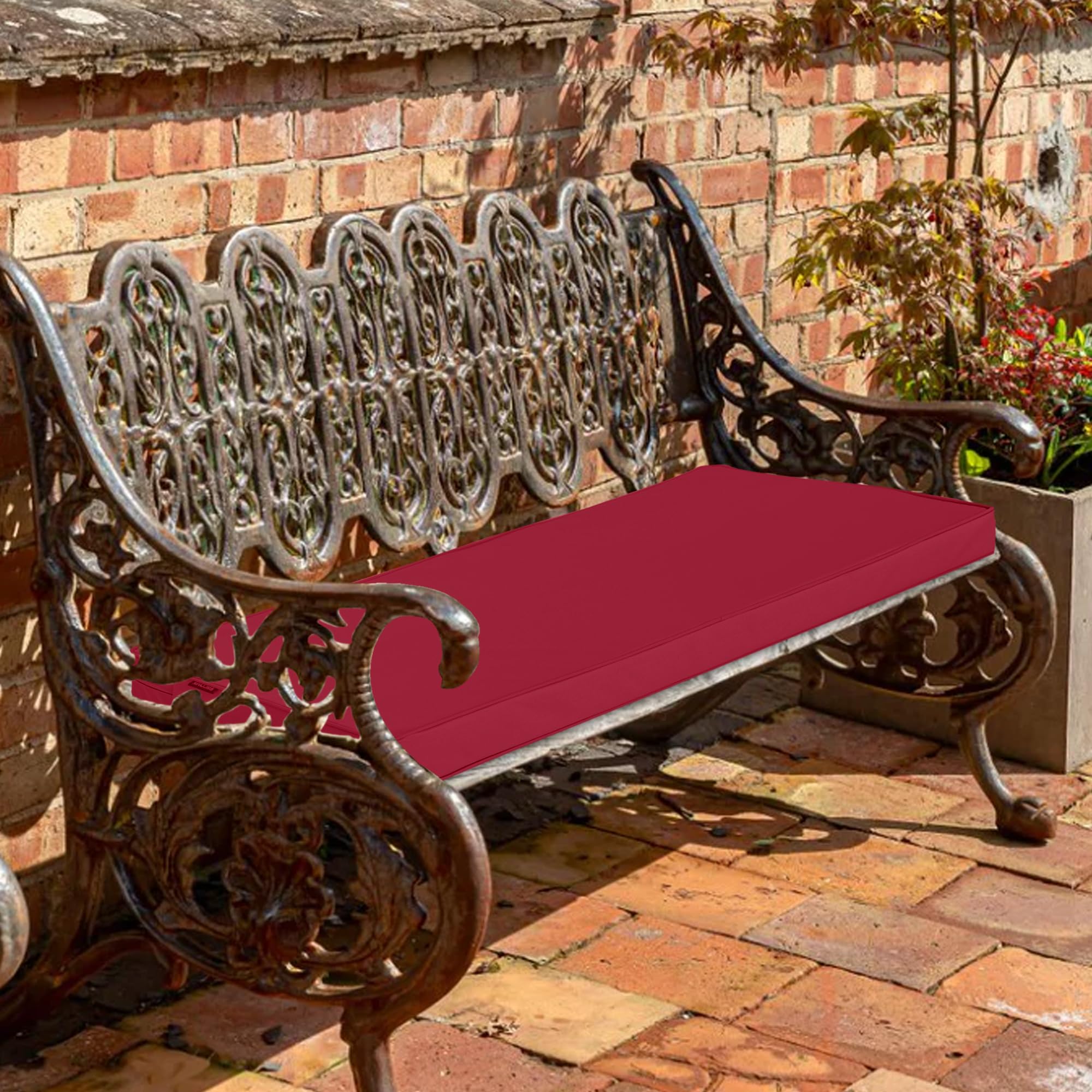 Comcaver Outdoor Bench Cushion against a garden backdrop