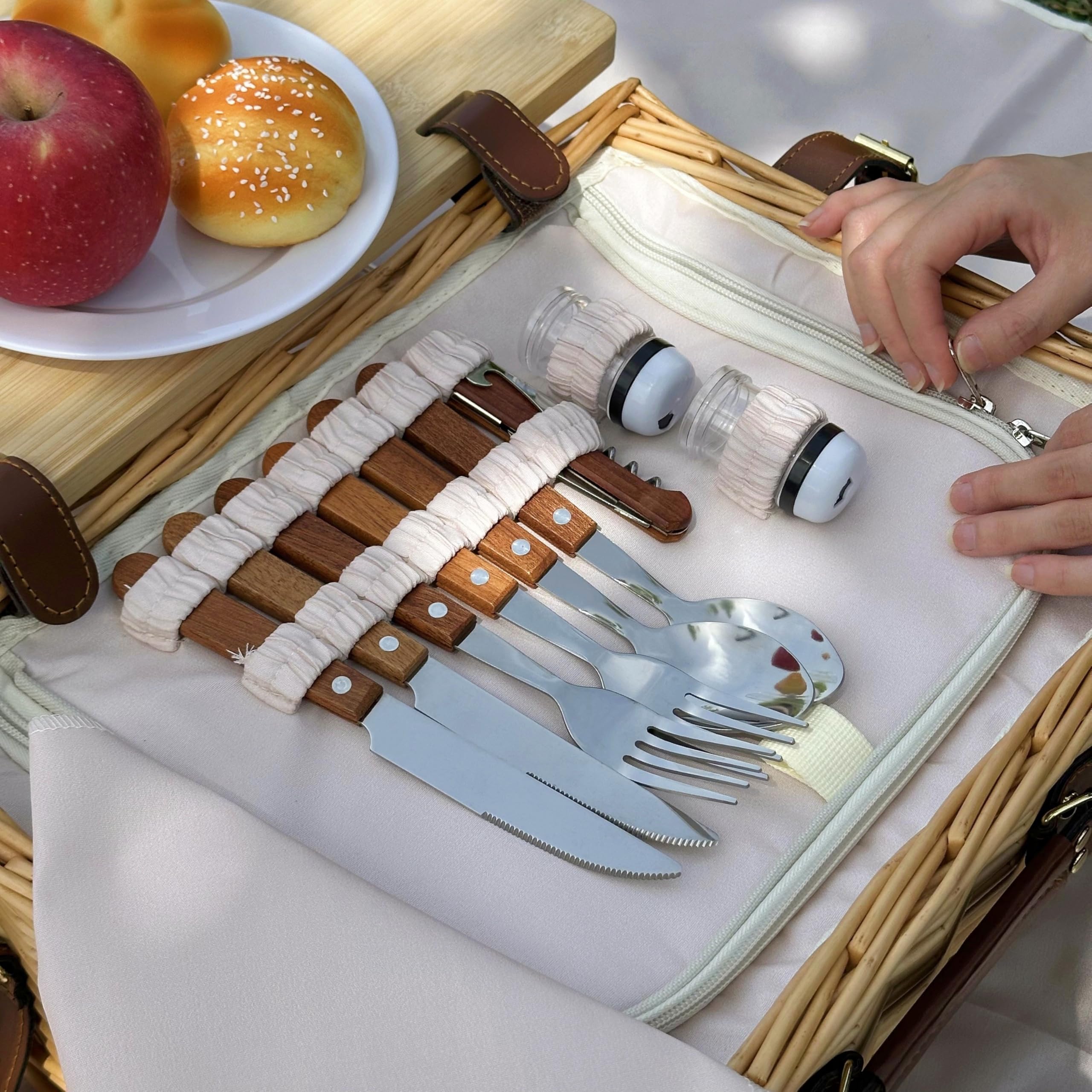 Complete picnic setup with blanket and basket outdoors