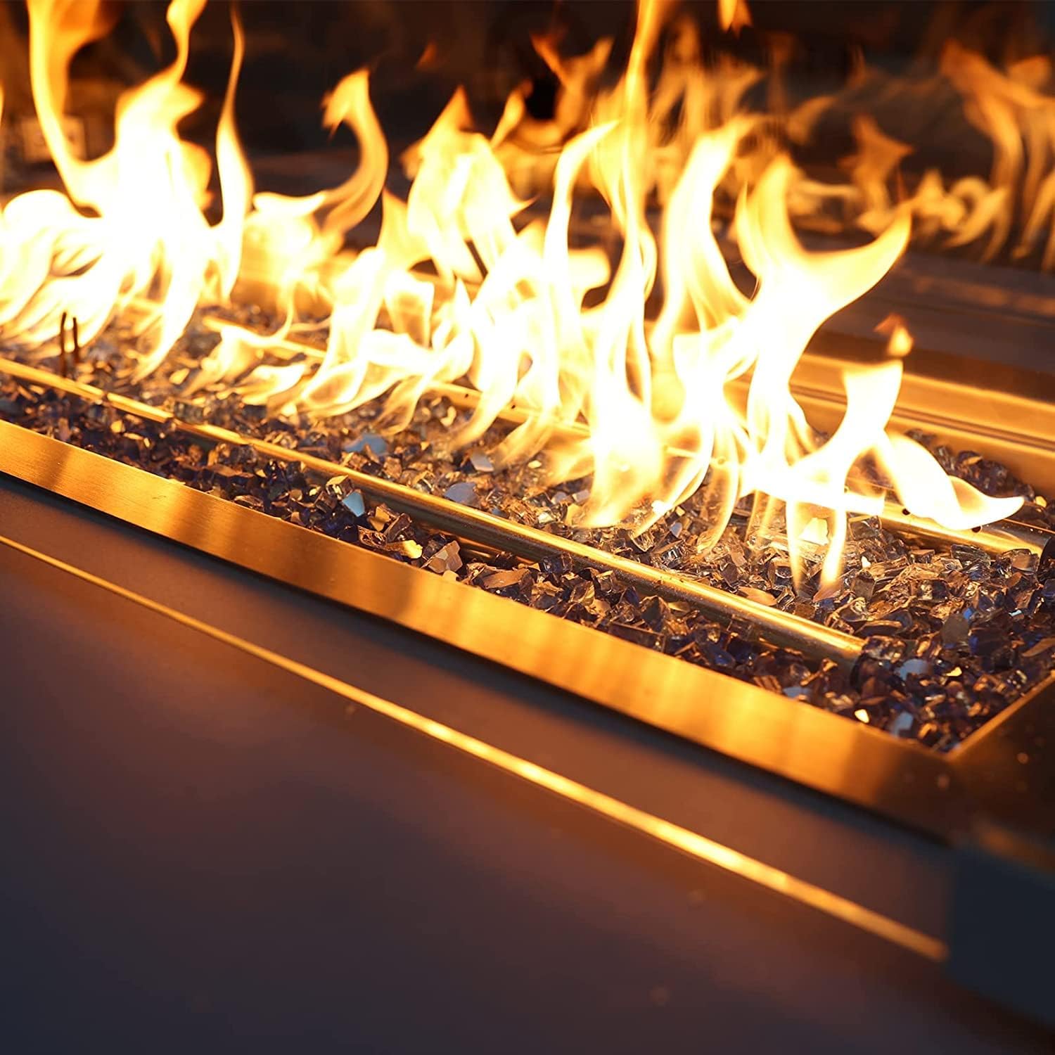 Copper fire glass dispersed in a garden setting