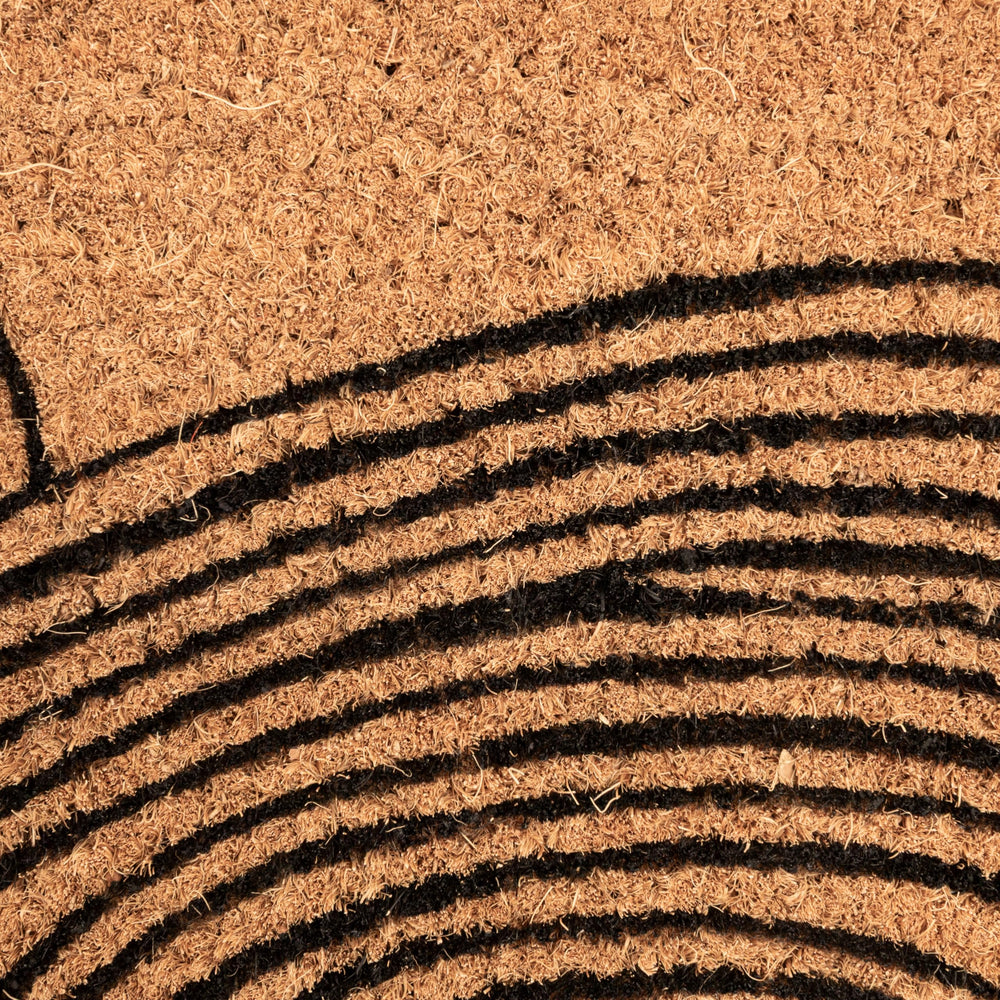Creative Co-Op Wave Print Coir Doormat in outdoor entryway