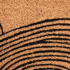 Creative Co-Op Wave Print Coir Doormat in outdoor entryway