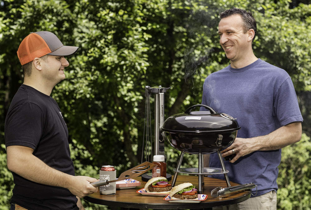 Cuisinart 14" Portable Charcoal Grill in outdoor setting