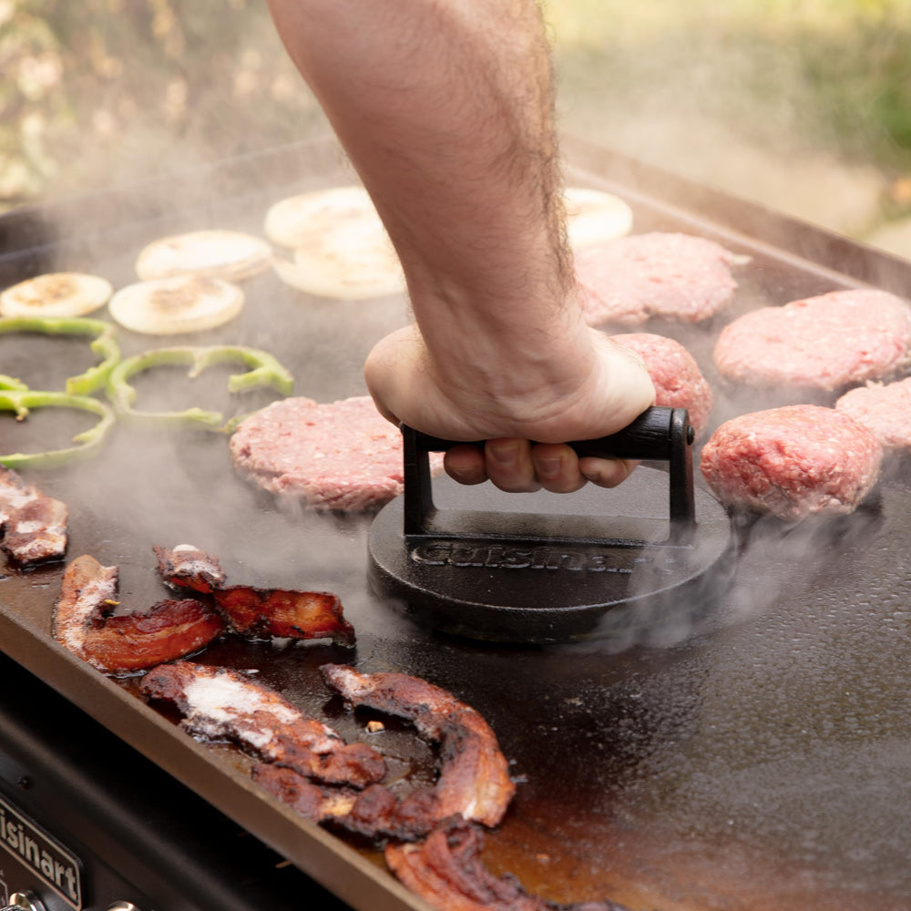 Cuisinart 6.5-inch burger press with burgers ready to cook