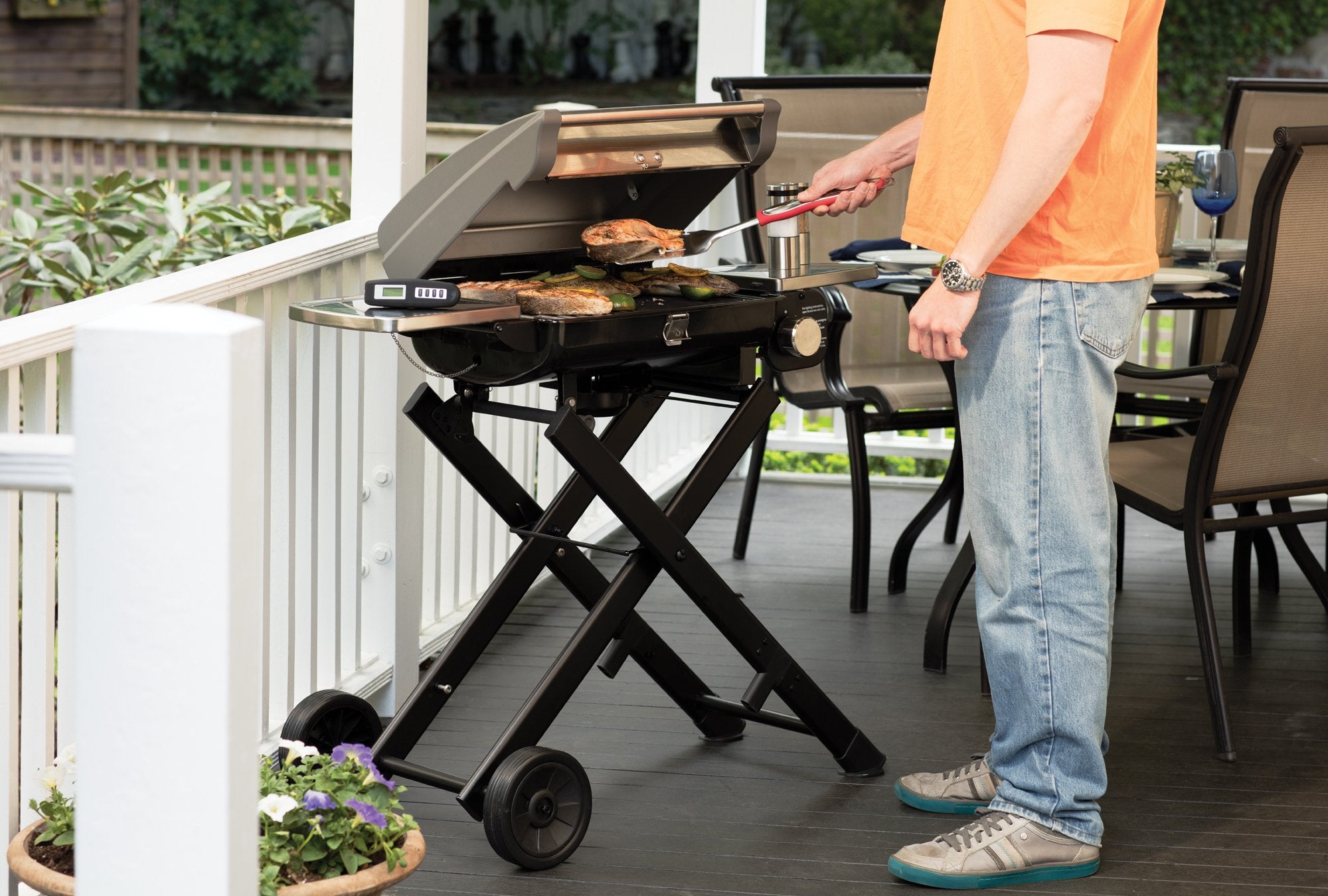 Cuisinart BBQ grilling tools set displayed outdoors on a picnic table