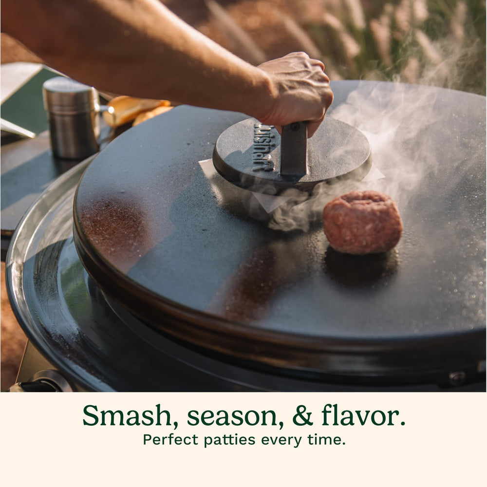 Cuisinart burger press in use on a skillet