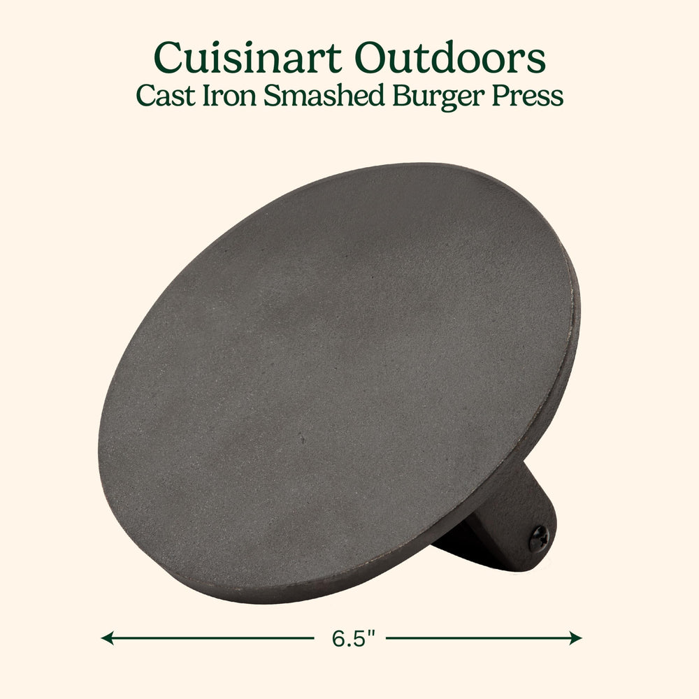 Cuisinart burger press with a juicy burger on a grill