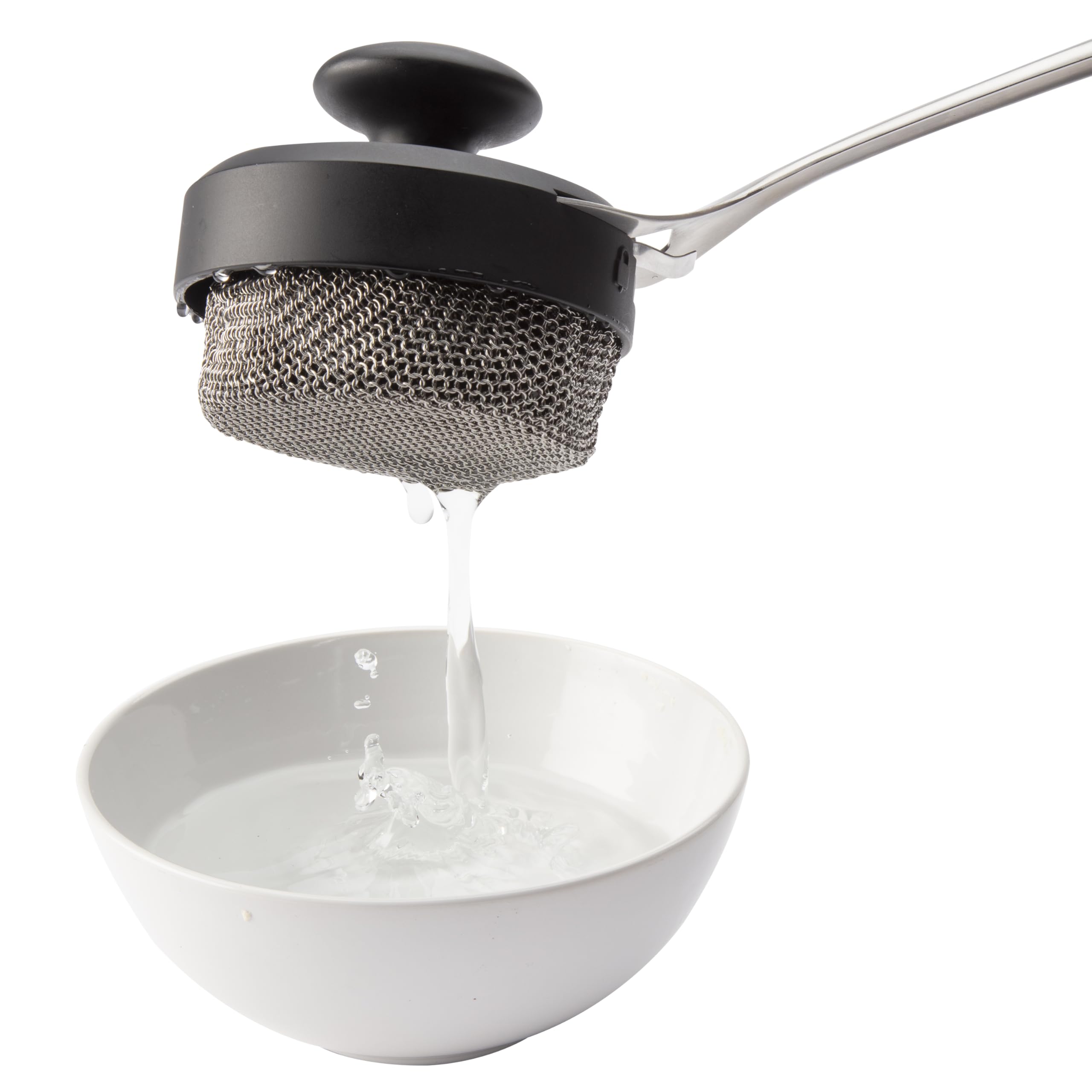 Cuisinart Chainmail Grill Cleaner being used on cast-iron cookware