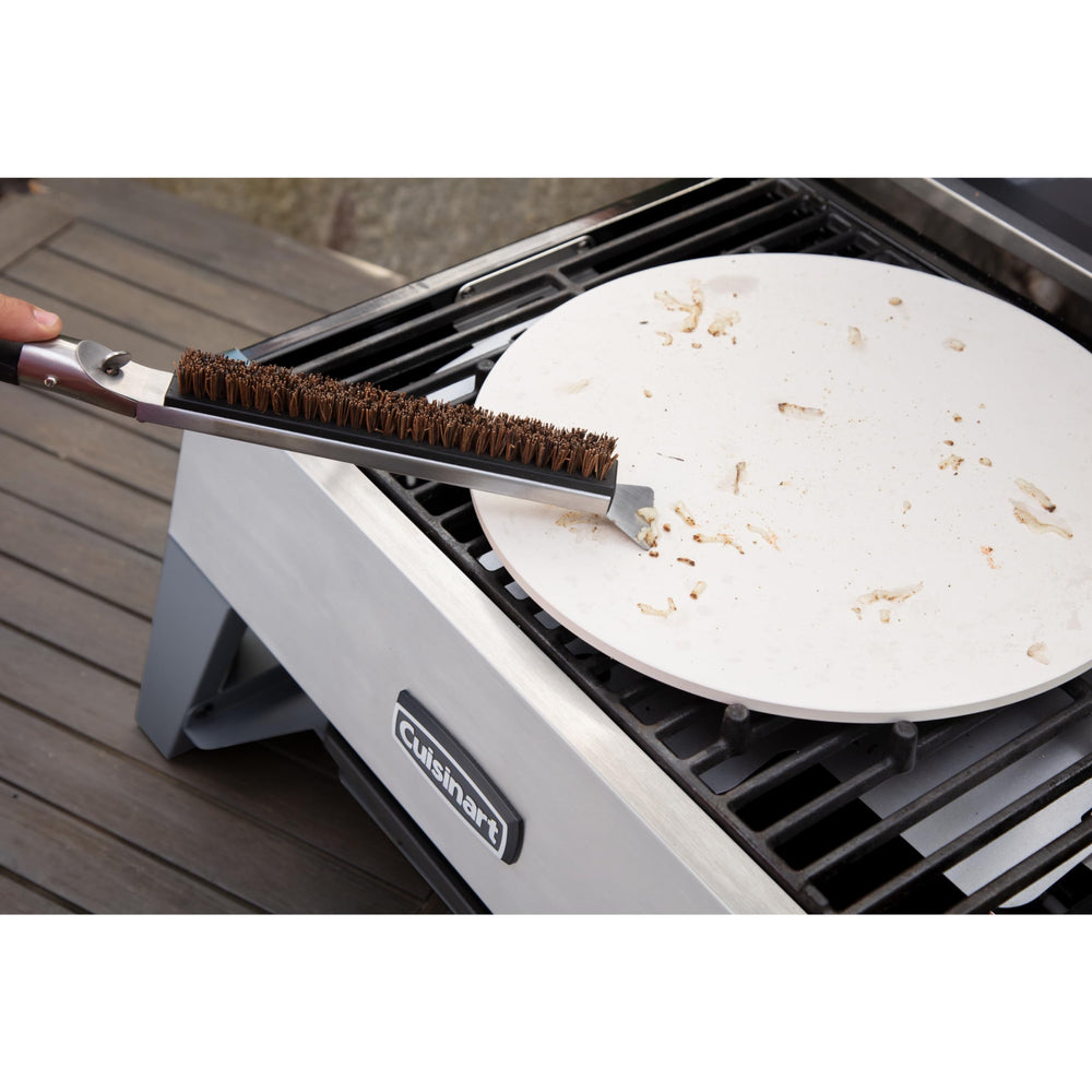 Cuisinart Pizza Stone Cleaning Brush resting on a kitchen counter
