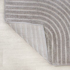 Curved ivory lines pattern on the gray JONATHAN Y rug