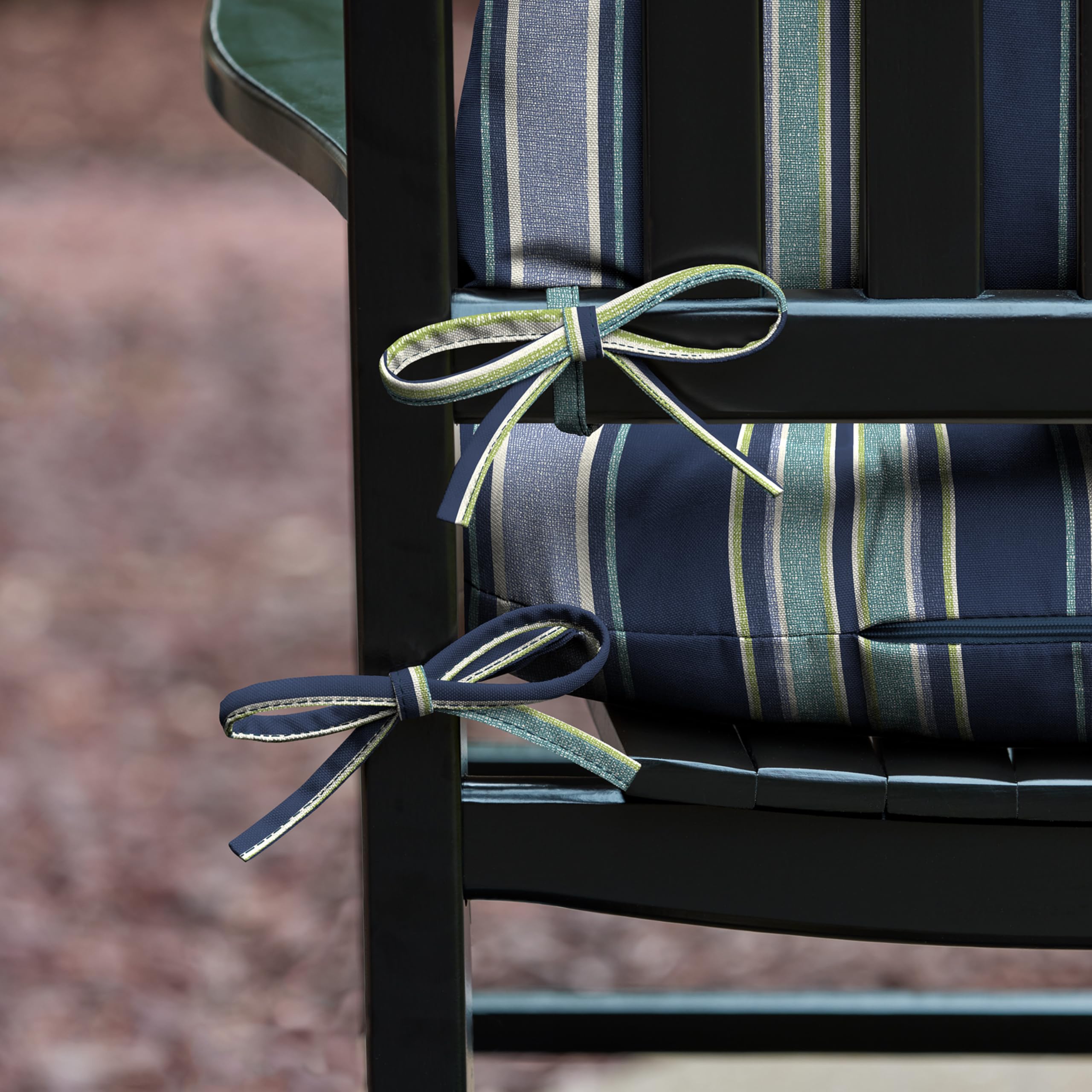 Cushion ties securing the cushion to the rocking chair